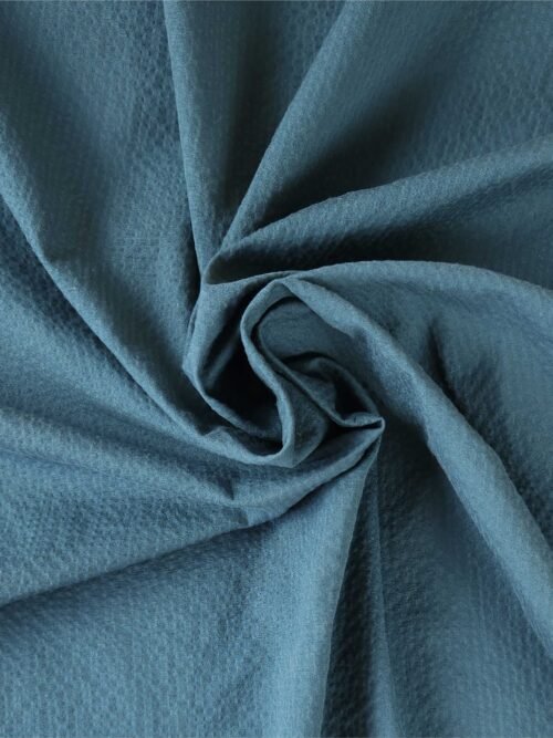 Tombé naturel du tissu seersucker bleu pétrole