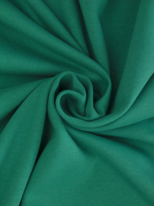 Drapé en spirale d’un molleton bleu vert sarcelle montrant la souplesse du tissu pour sweat.